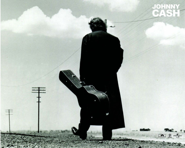 Man holding guitar case right free wallpaper - medium preview image