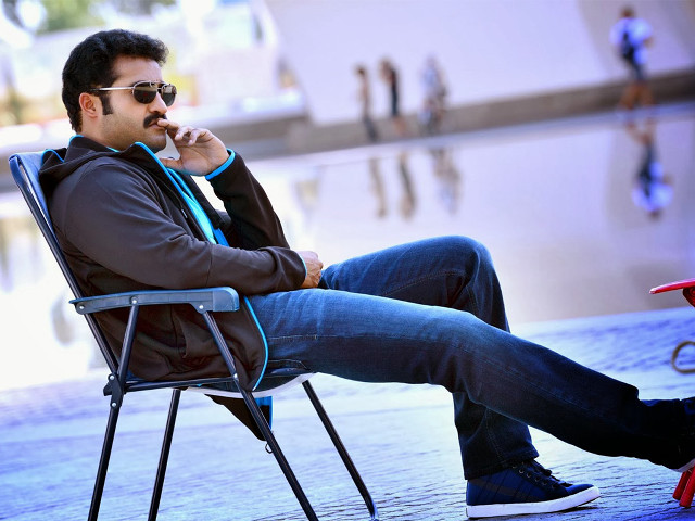 Man chair smoking cigarette public free wallpaper - medium preview image