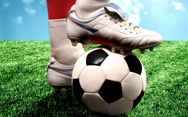 Person soccerball grass sky clouds #2 free wallpaper - medium preview image