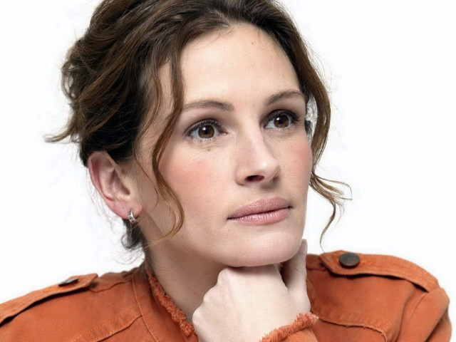 Woman brown jacket serious look free wallpaper - medium preview image