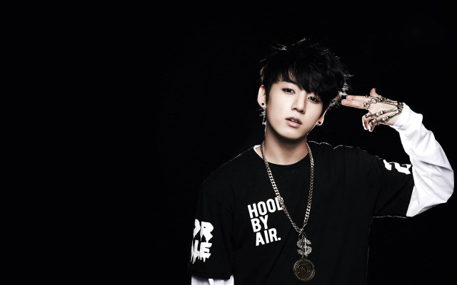 Person necklace black shirt pose free wallpaper - medium preview image