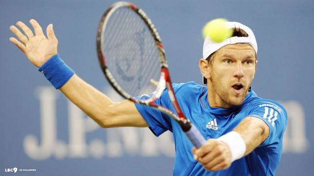 Man swinging tennis racket ball free wallpaper - medium preview image