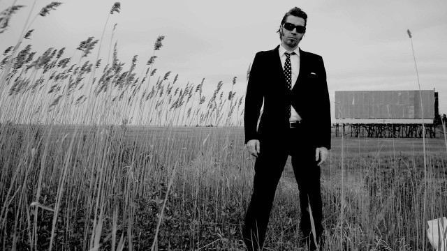 Man suit tie field grass free wallpaper - medium preview image