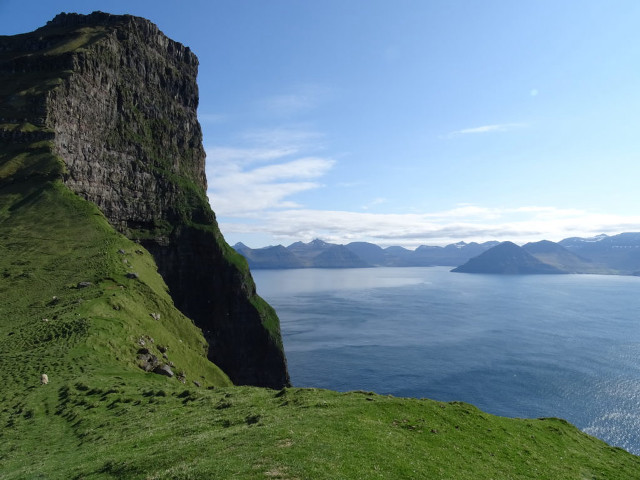 Grassy hill water mountains blue free wallpaper - medium preview image