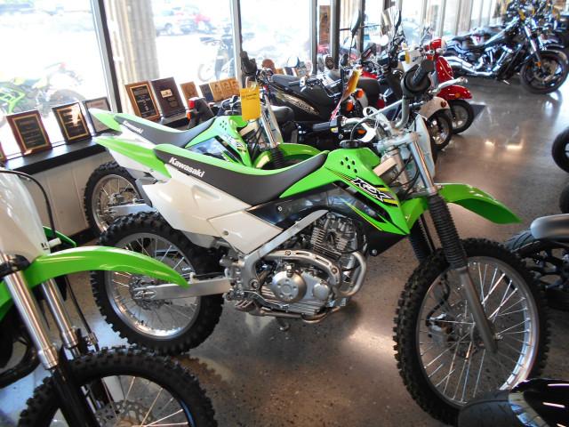 Green white dirtbike inside building free wallpaper - medium preview image