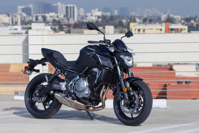 Black motorcycle parking lot city free wallpaper - medium preview image