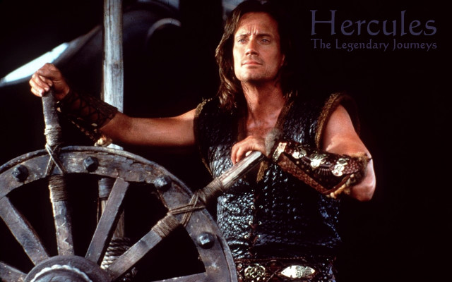 Man costume sword wheel holding free wallpaper - medium preview image