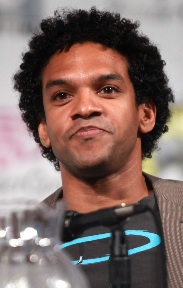 Afrofuturism man blackhair grayjacket water free wallpaper - medium preview image