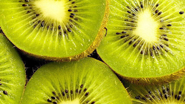 Kiwi slices closeup stacked bite free wallpaper - medium preview image