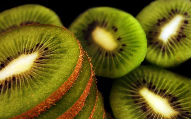 Kiwi fruit sliced closeup stacked free wallpaper - medium preview image