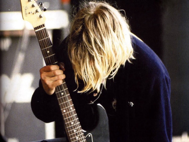 Man long hair holding guitar free wallpaper - medium preview image