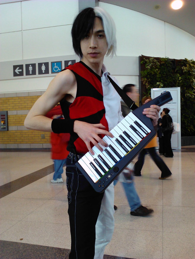 Man red vest keyboard lobby free wallpaper - medium preview image
