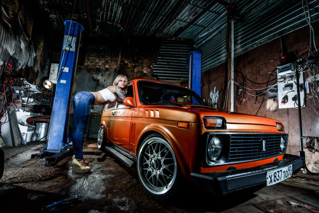 Man leaning truck garage punchingbag free wallpaper - medium preview image