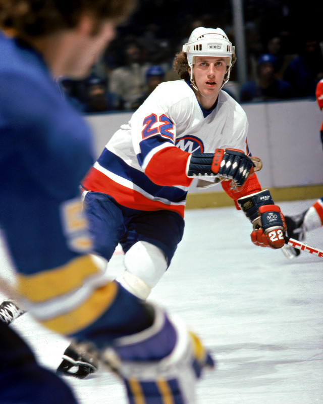 Hockey player moving ice puck #2 free wallpaper - medium preview image