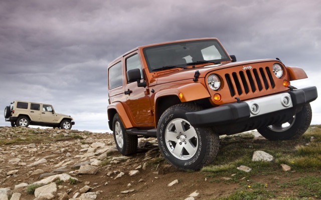 Jeeps parked rocky hill cloudy free wallpaper - medium preview image