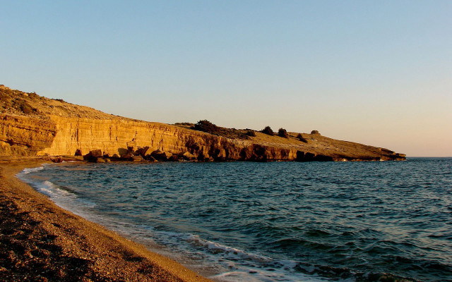 Rocky cliff shore beach water free wallpaper - medium preview image