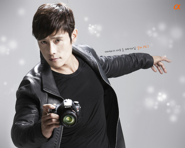 Man holding camera pointing white free wallpaper - medium preview image