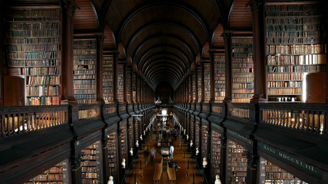 Long library bookshelves people sitting free wallpaper - medium preview image