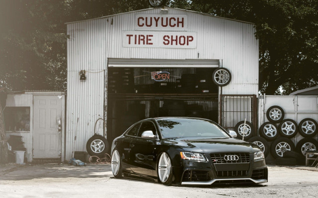 Black car tire shop night free wallpaper - medium preview image