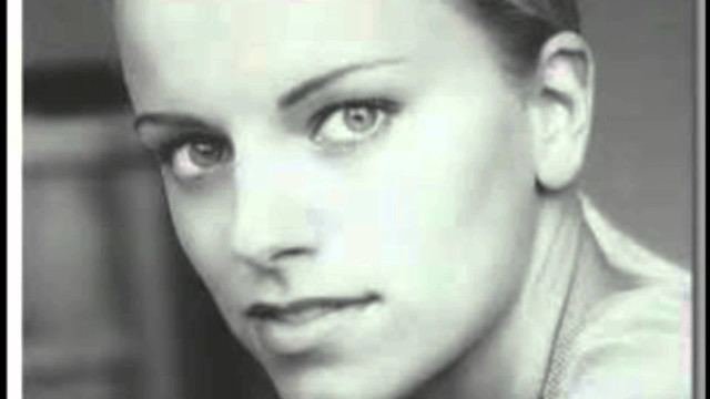 Woman shaved head tie serious free wallpaper - medium preview image