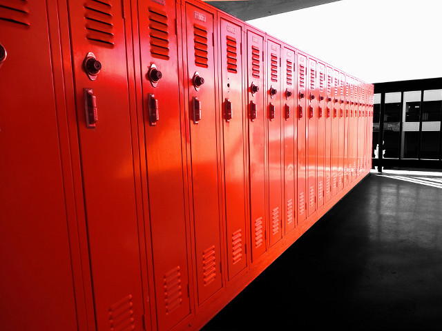 Red lockers person standing background free wallpaper - medium preview image