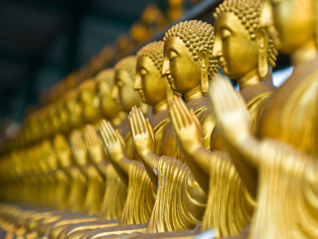 Golden buddha statues row table free wallpaper - medium preview image