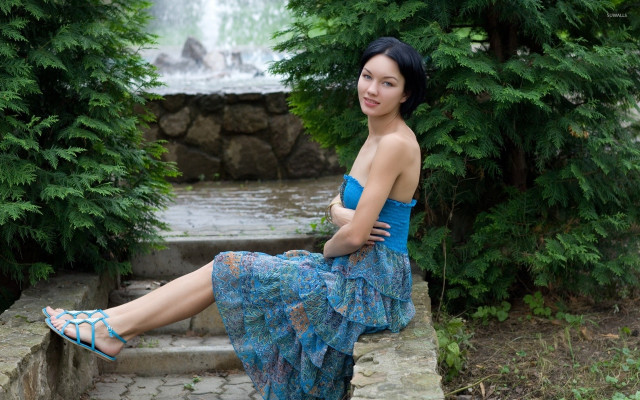 Woman sitting waterfall blue dress free wallpaper - medium preview image