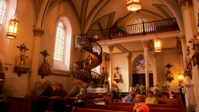 Church crowd spiral staircase interior free wallpaper - medium preview image