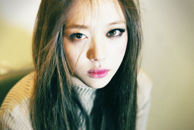 Woman long hair sweater serious #3 free wallpaper - medium preview image
