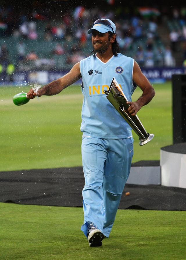 Man blue uniform holding trophy free wallpaper - medium preview image