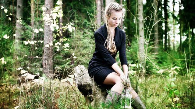Woman sitting rock forest background free wallpaper - medium preview image