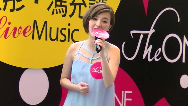 Woman holding pink object microphone free wallpaper - medium preview image