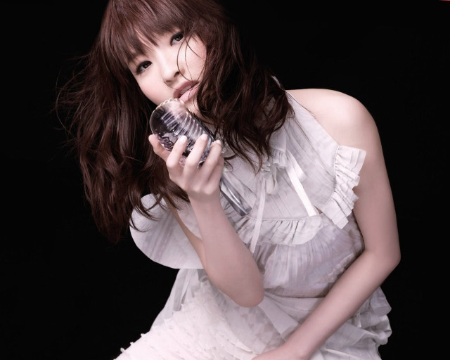 Woman white dress holding water free wallpaper - medium preview image