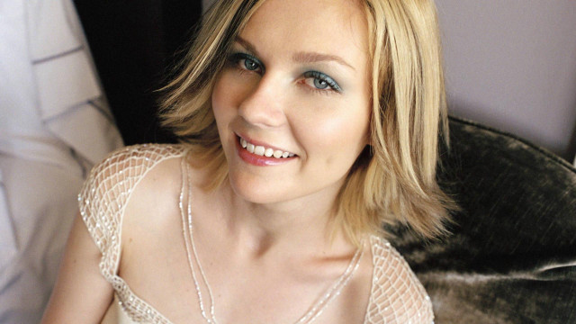 Woman white dress necklace couch free wallpaper - medium preview image