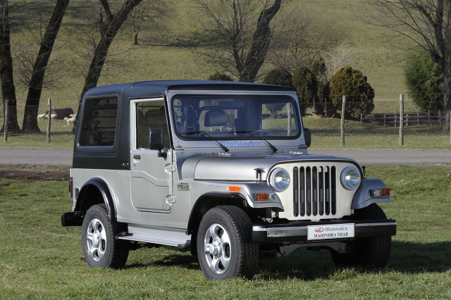Jeep parked grassy field near free wallpaper - medium preview image