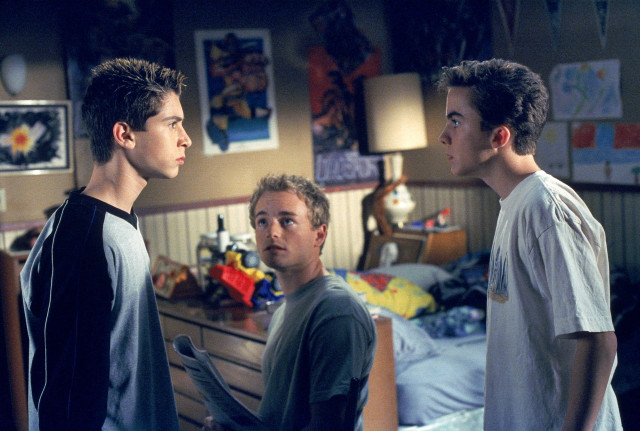 Three young men bedroom bed free wallpaper - medium preview image
