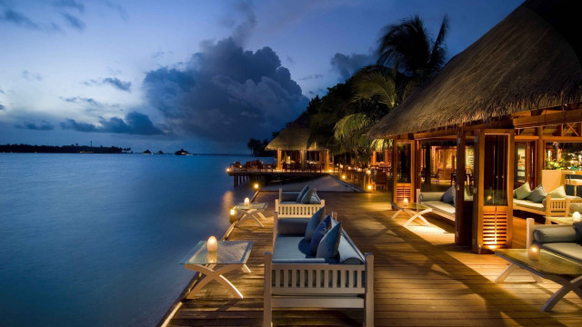 Dock chairs tables night ocean free wallpaper - medium preview image