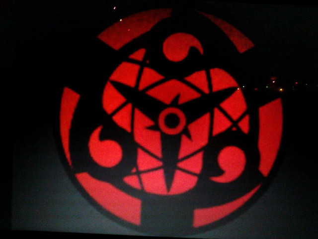 Red circular object black background free wallpaper - medium preview image