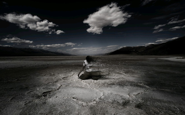 Woman sitting rock desert mountains free wallpaper - medium preview image