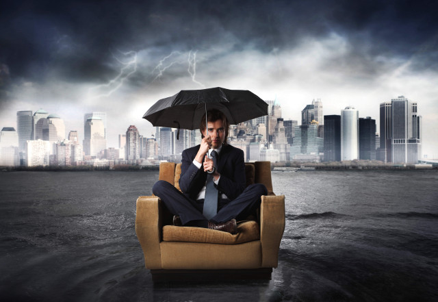Man sitting chair umbrella city free wallpaper - medium preview image