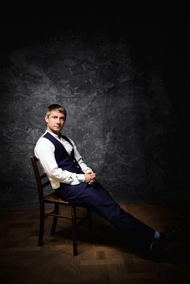 Man sitting black room elegant free wallpaper - medium preview image