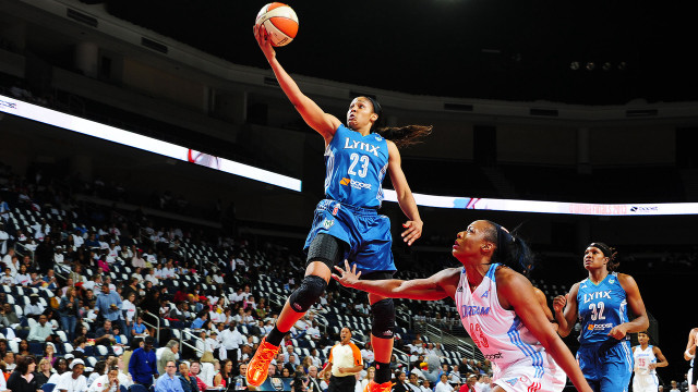 Woman dunk basketball game crowd free wallpaper - medium preview image