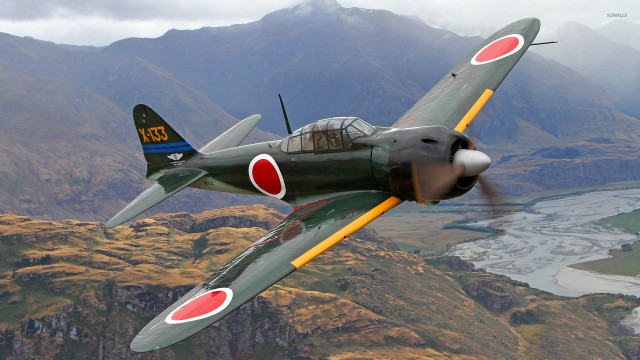 Green airplane flying mountain range #2 free wallpaper - medium preview image