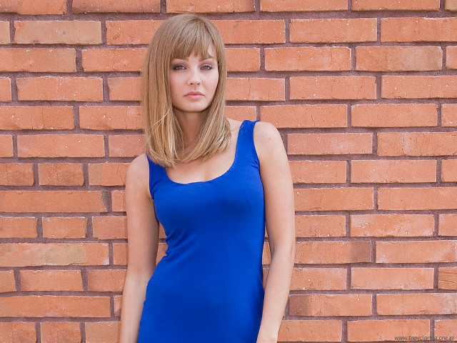 Woman blue dress brick wall free wallpaper - medium preview image