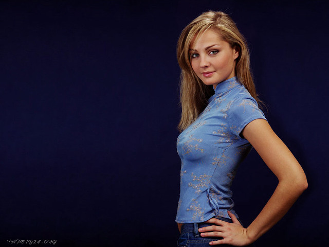 Woman blue shirt jeans hands free wallpaper - medium preview image