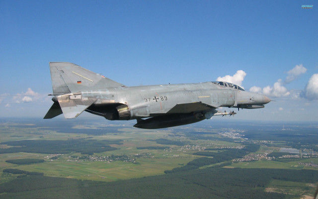 Fighterjet blueSky greenField townDauAlSet puzzleErnst free wallpaper - medium preview image
