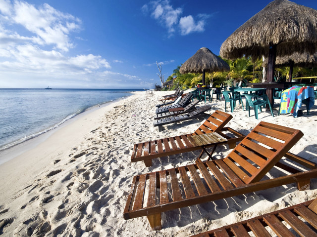Beach lawn chairs thatched umbrellas free wallpaper - medium preview image
