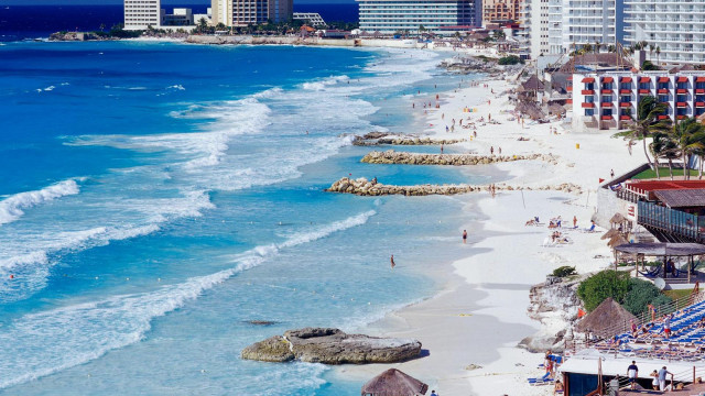 Beach people buildings ocean sky free wallpaper - medium preview image