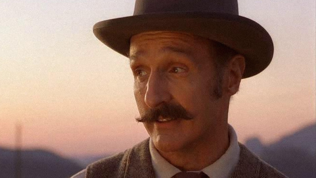 Man mustache hat camera mountain free wallpaper - medium preview image