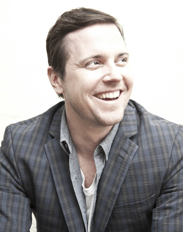 Man suit smiling camera white free wallpaper - medium preview image